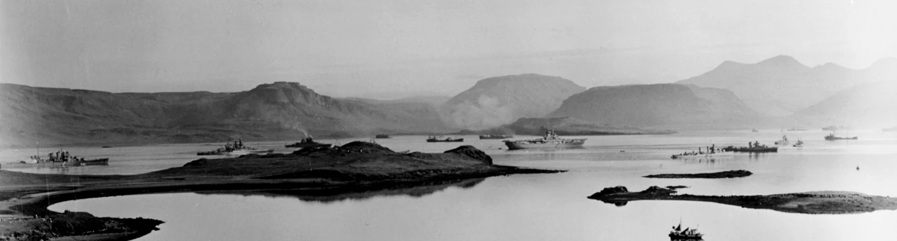 Hvalfjörður in October 1941 — Allied battleships, cruisers and destroyers at anchor between the same mountains
